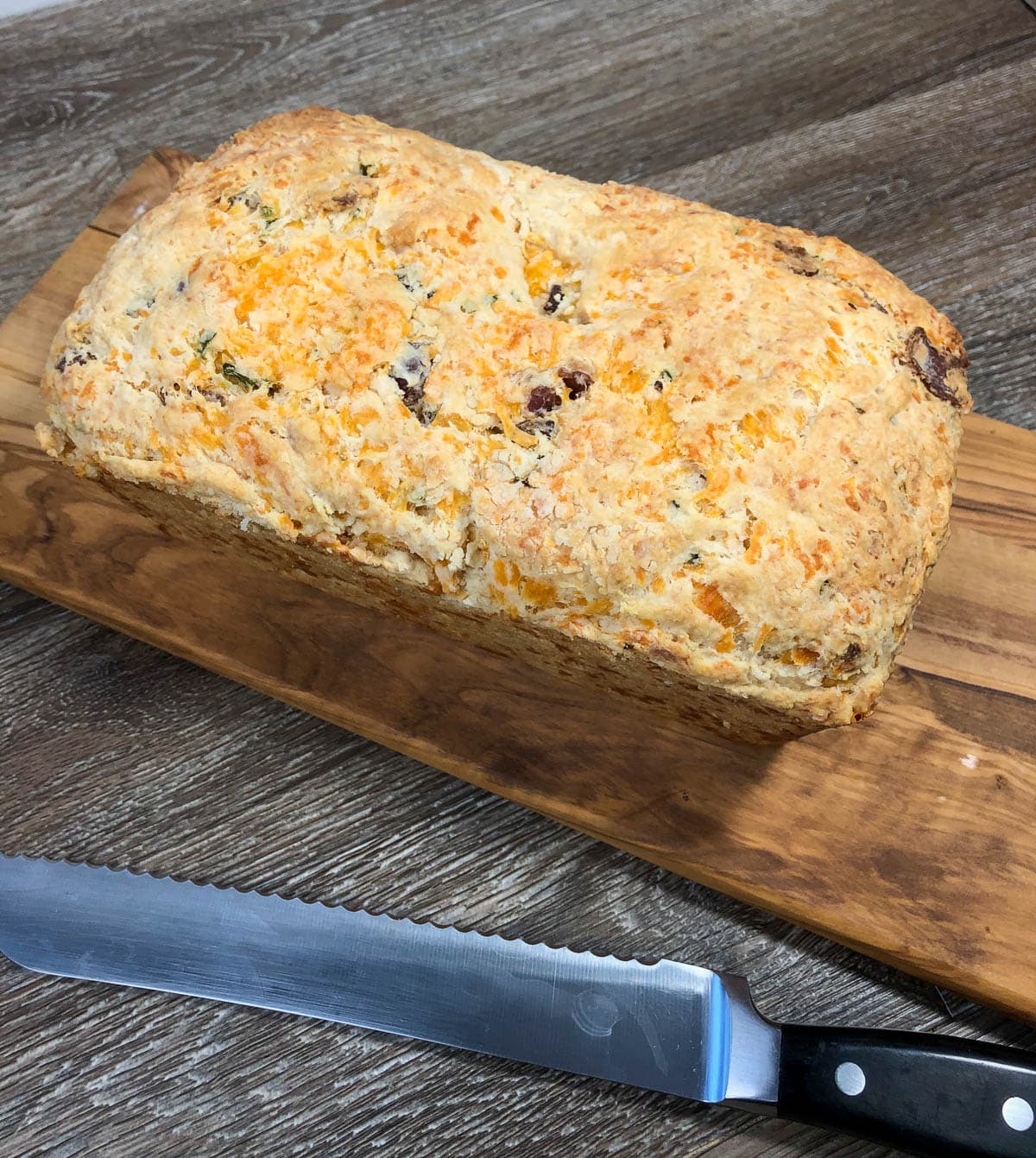 bread on board with knife