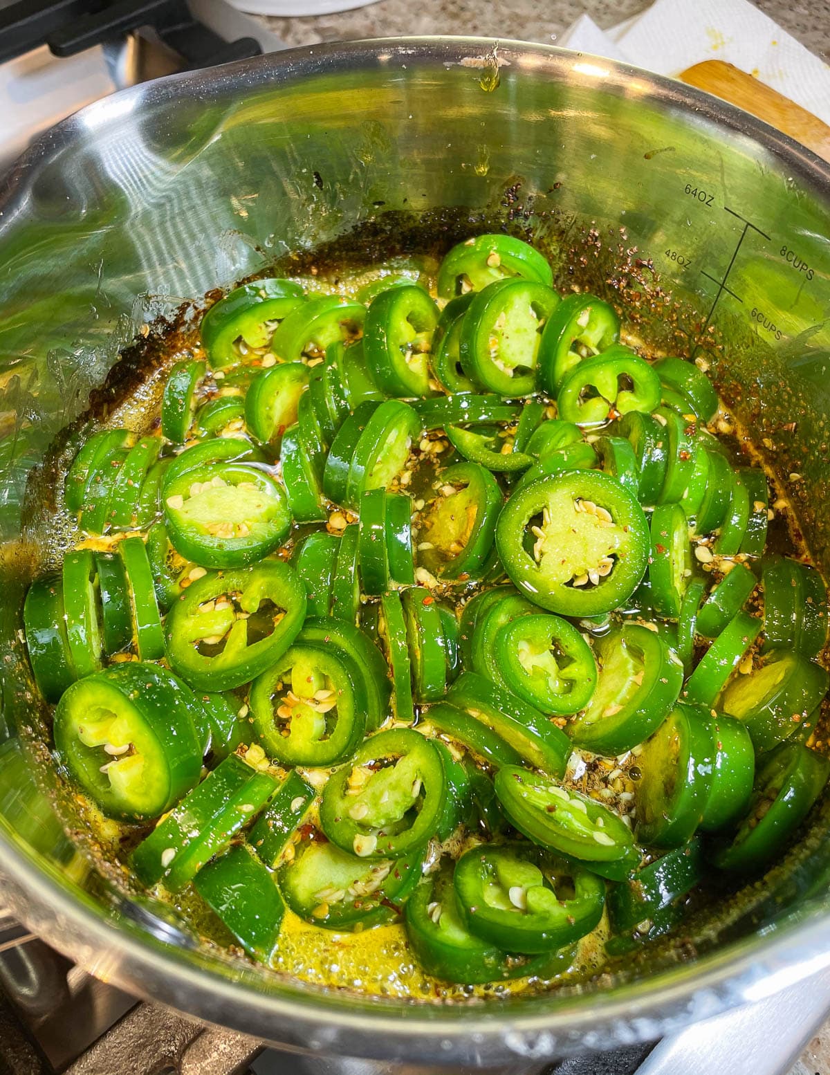 jalapeños boiling in saucepan