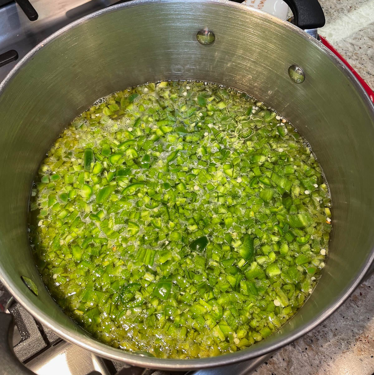 diced jalapeños in pot
