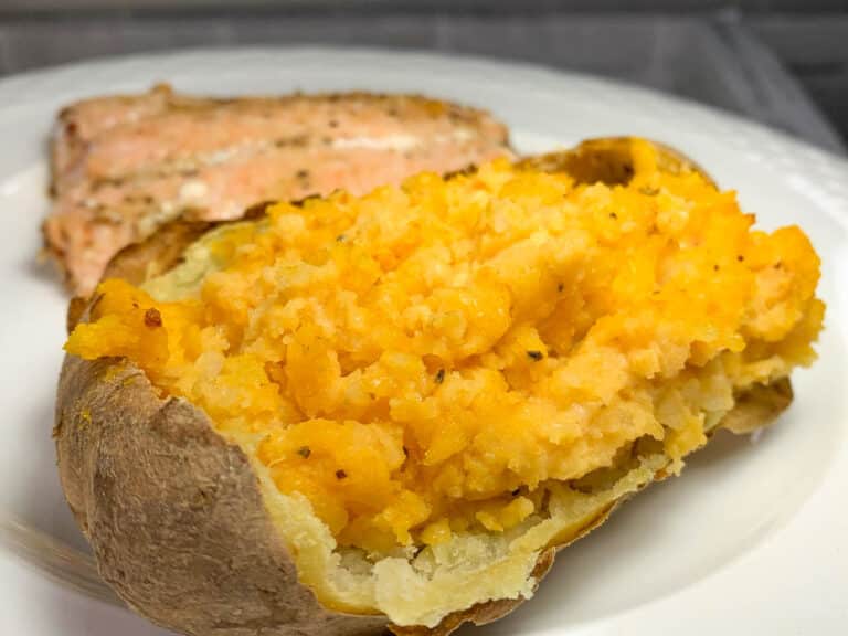 baked potato and salmon on plate