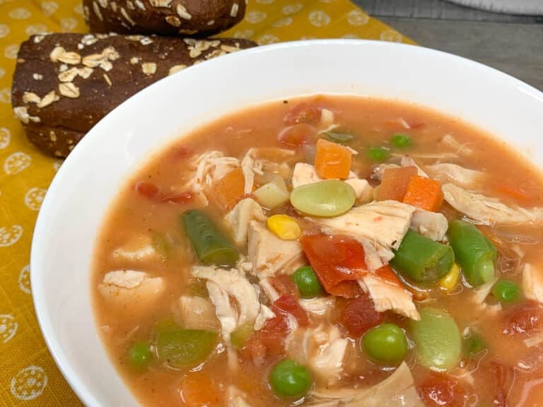bowl of chicken stew with bread
