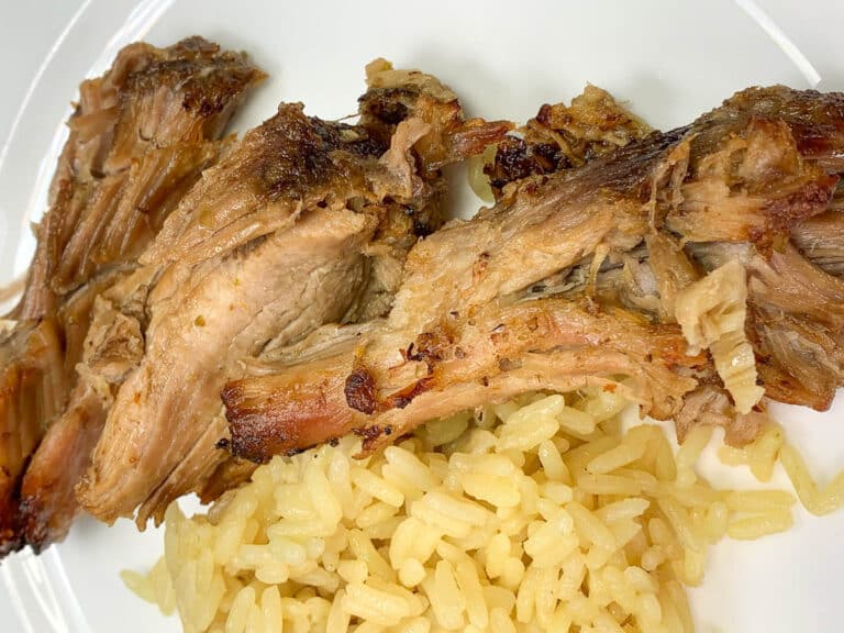 shredded pork on a plate with rice