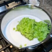 pureed peppers and sugar in saucepan