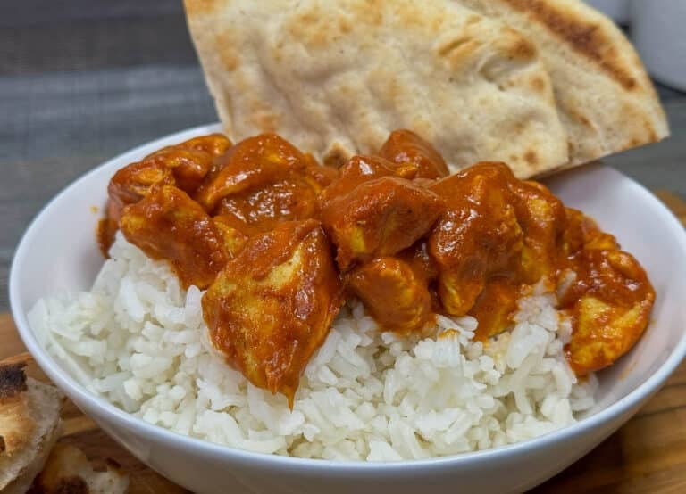 butter chicken in a bowl over rice