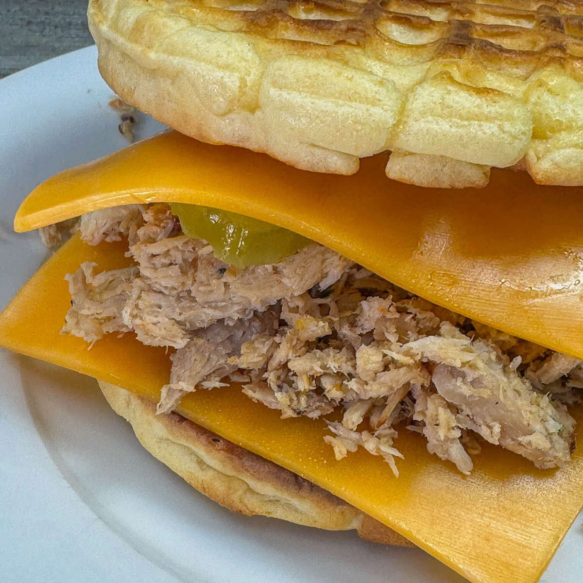 pulled pork cheddar waffle sandwich